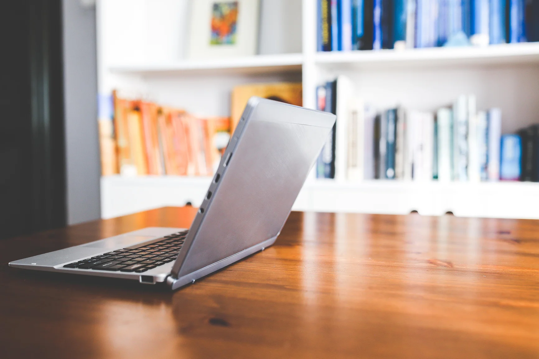 Work from home, home office image of laptop on a wooden table