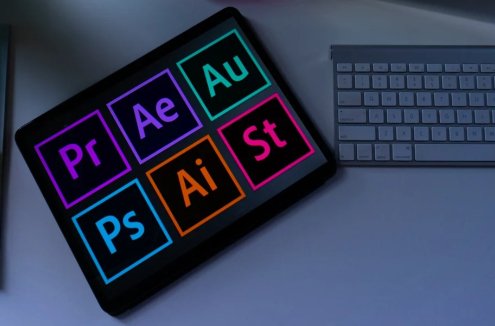 Free and affordable alternatives to Adobe Creative Cloud - image of a notepad, a tablet with the CC logos, and a mouse and keyboard